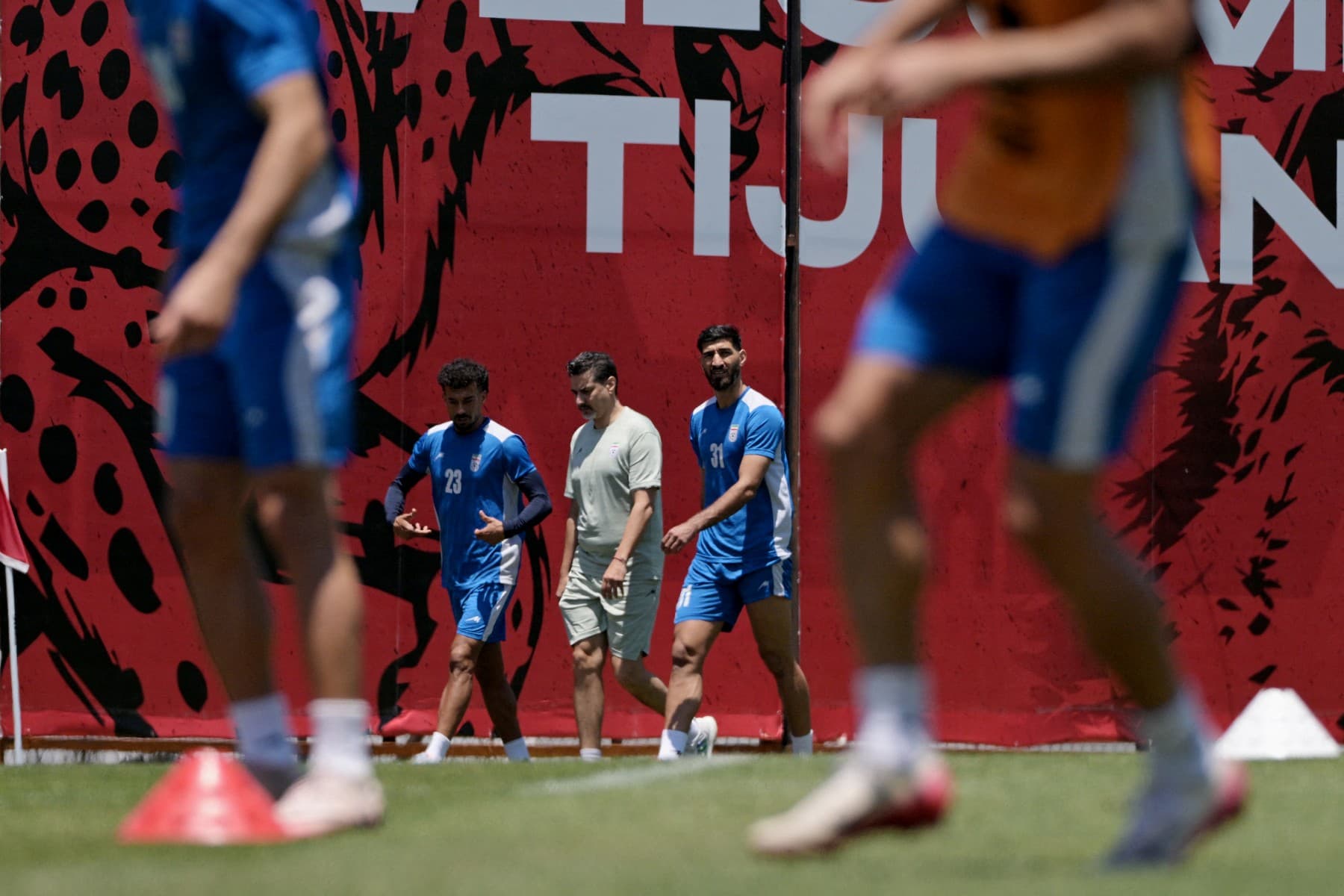 Iran's defender #23 Ramin Rezaeian and midfielder #31 Mehdi Ghayedi take part in a training session ahead of Iran's FIFA World Cup 2026 Group G football match against Belgium at Centro Xoloitzcuintle in Tijuana on June 18, 2026. (Photo by Guillermo Arias