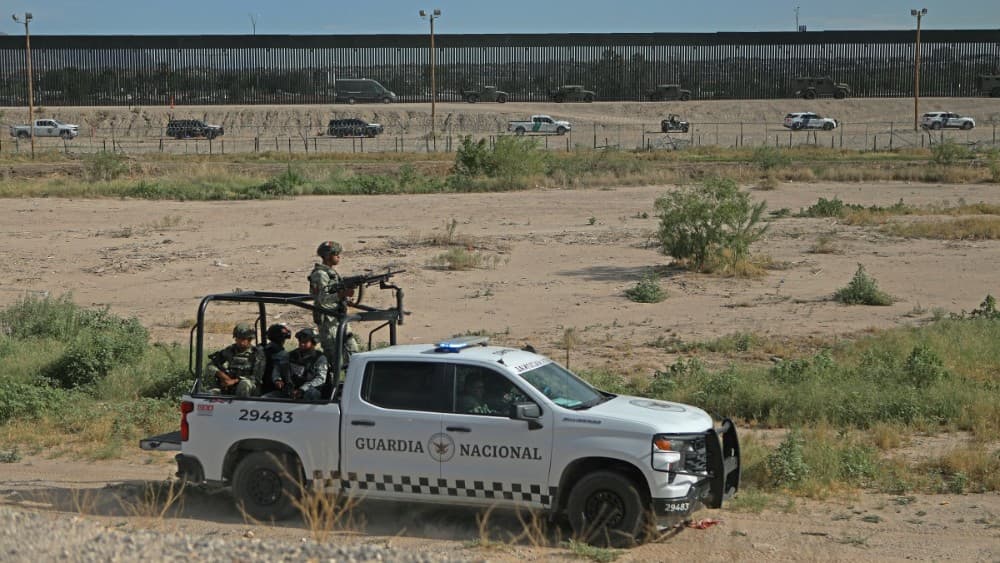 Members of Mexico’s National Guard patrol the area as U.S. Customs and Border Protection (CBP) Air and Marine Operations (AMO) officers conduct a demonstration of their rapid response capabilities during a joint, combined exercise at the border between El