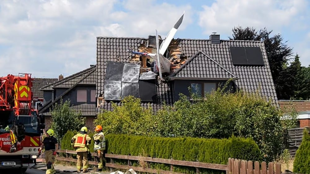 Two dead after plane crashes onto German house's roof