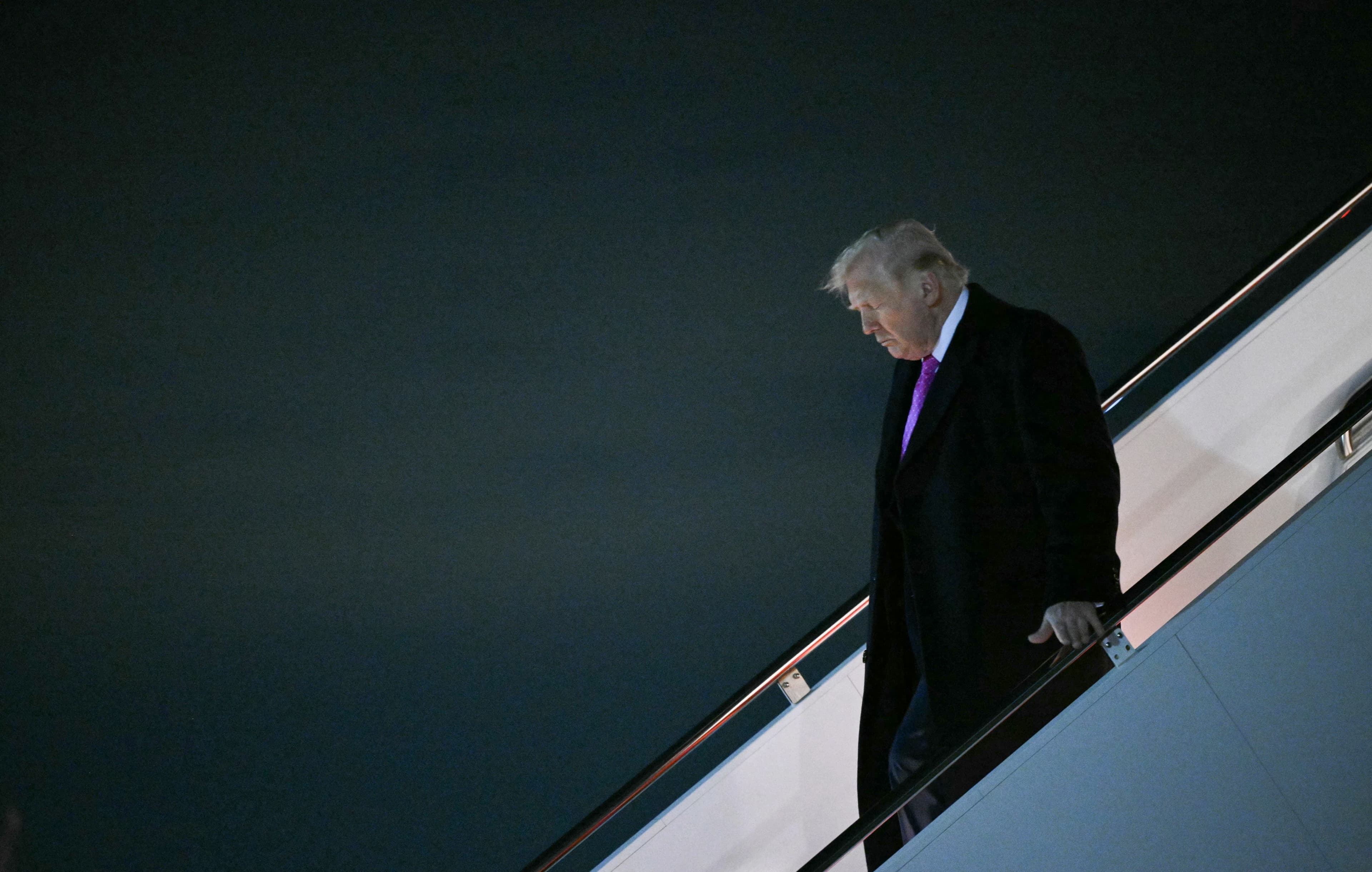 US President Donald Trump steps off Air Force One upon arrival at Joint Base Andrews, Maryland on March 29, 2026. (AFP)