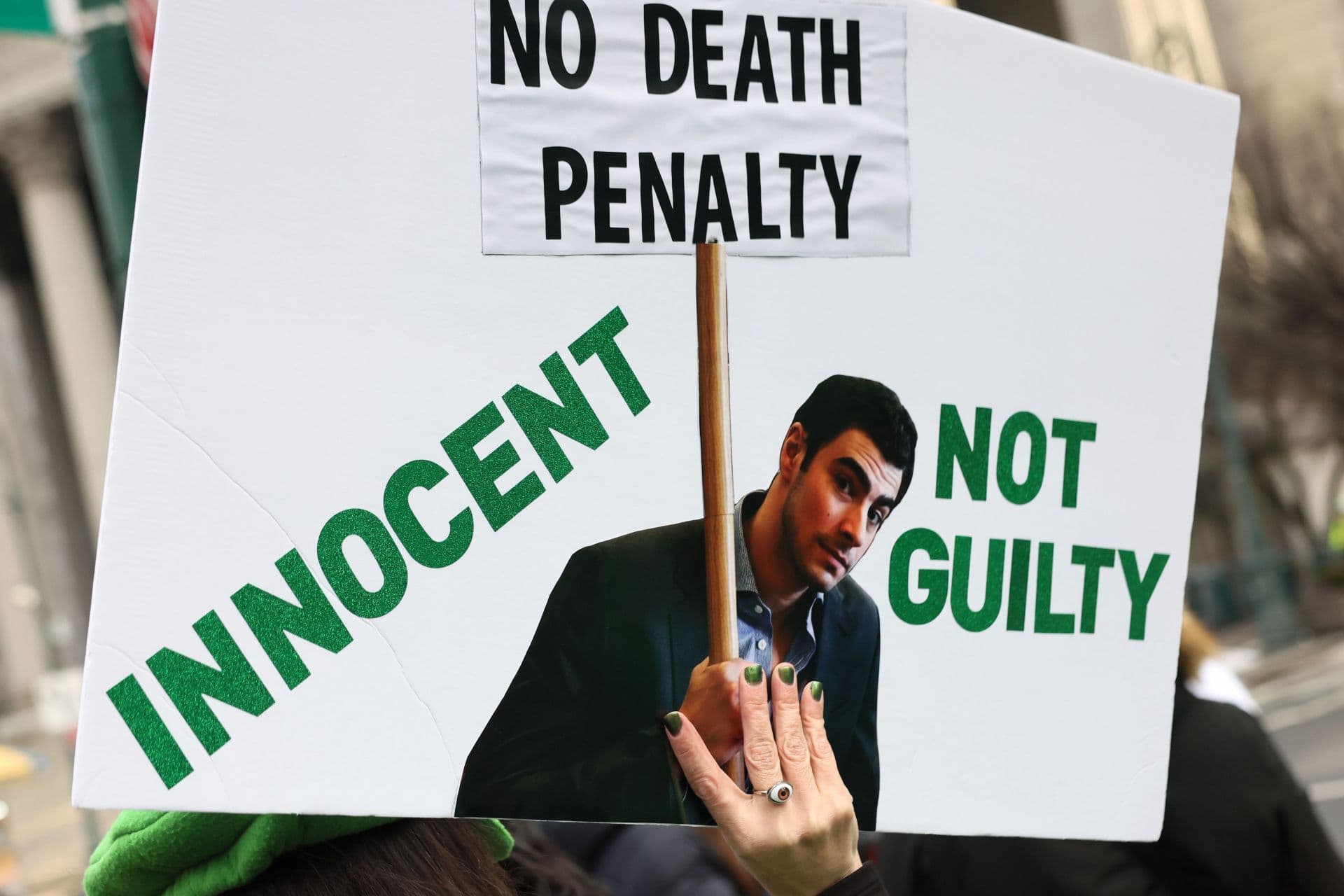 Supporters of Luigi Mangione wait in line to enter Manhattan Federal Court on January 09, 2026 in New York City. (AFP)