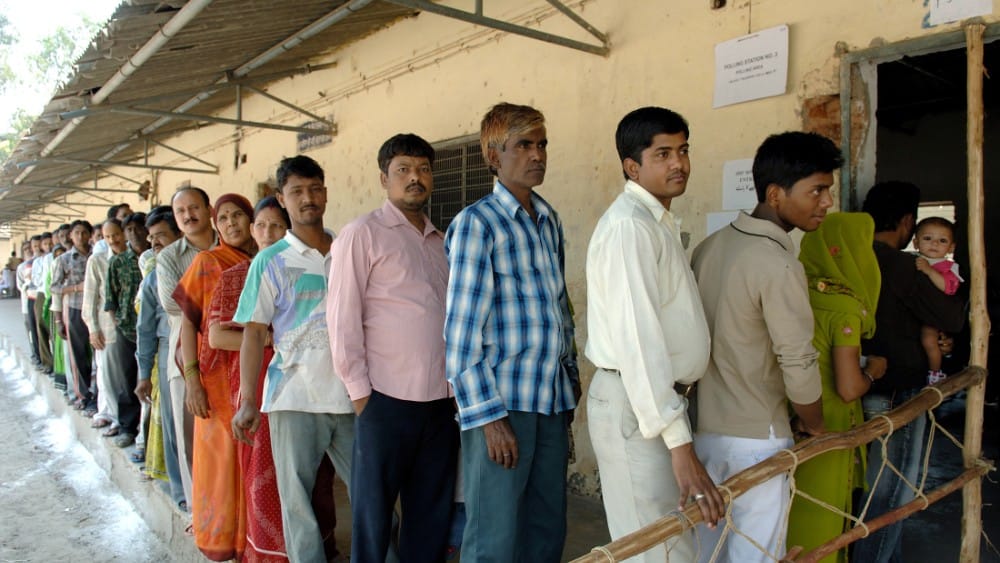The voters standing in a queue for their turn to cast votes at a polling station in Delhi. (Photo: Wikimedia Commons)