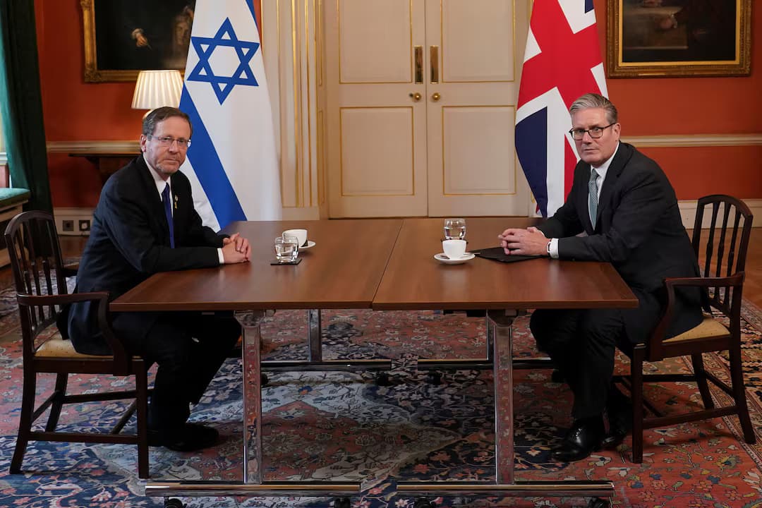 Britain's Prime Minister Keir Starmer sits with Israel's President Isaac Herzog as he visits 10 Downing Street in London, Sept. 10, 2025. Alberto PezzaliPool via REUTERS.avif