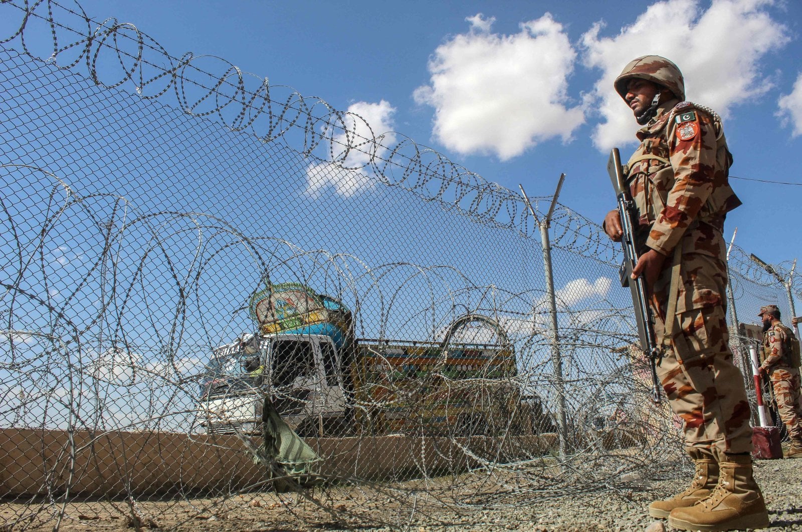 Pakistani soldiers keep watch at the Pakistan-Afghanistan border in Chaman, Balochistan province on March 19, 2026. (AFP)