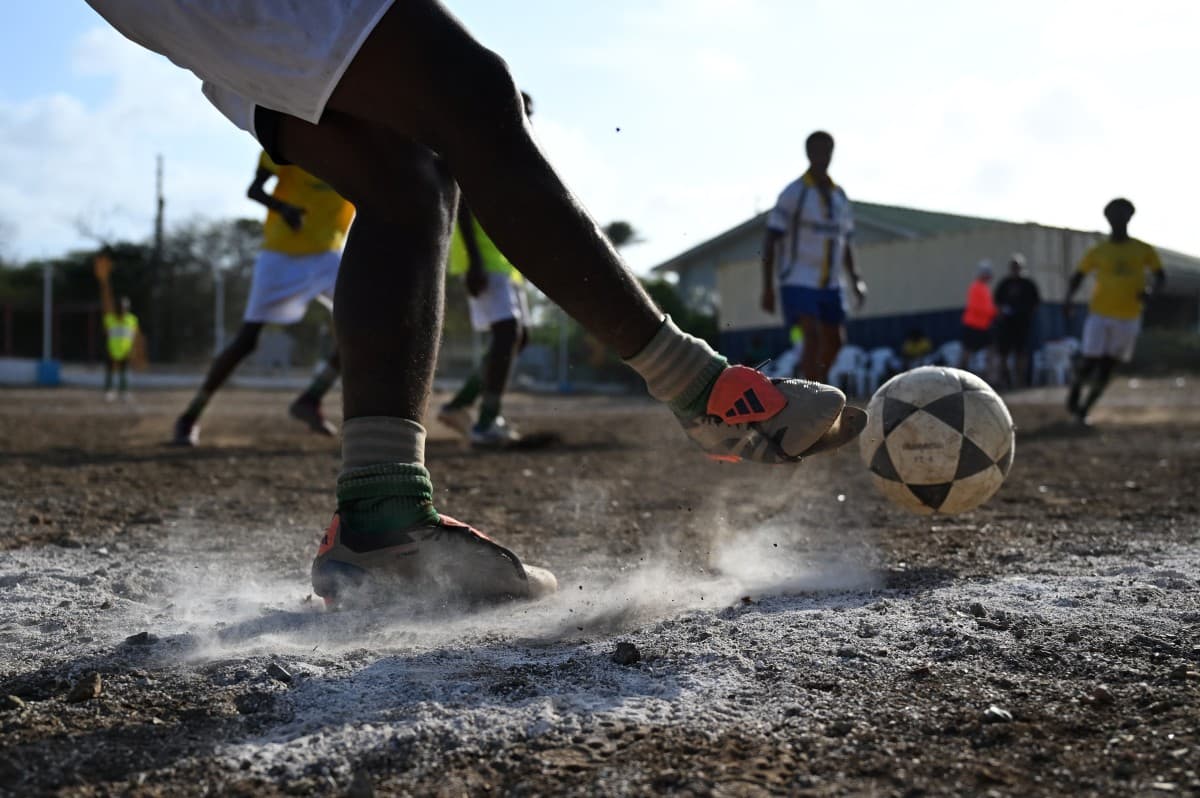 Football players take part in a training session of the Bicentini Foundation football school in the Fuik neighborhood, east of Willemstad, in the Dutch Caribbean, on April 11, 2026.