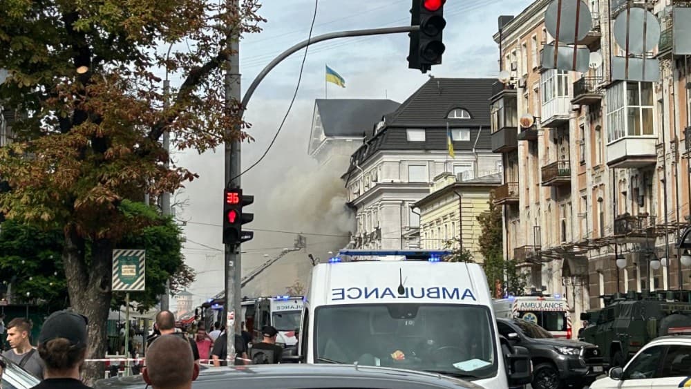 Onlookers watch as Ukrainian rescue personnel work to extinguish a fire in the headquarters of the Security Service of Ukraine (SBU) following an air attack in Kyiv on September 4, 2026, amid the Russian invasion of Ukraine. (File photo: AFP)